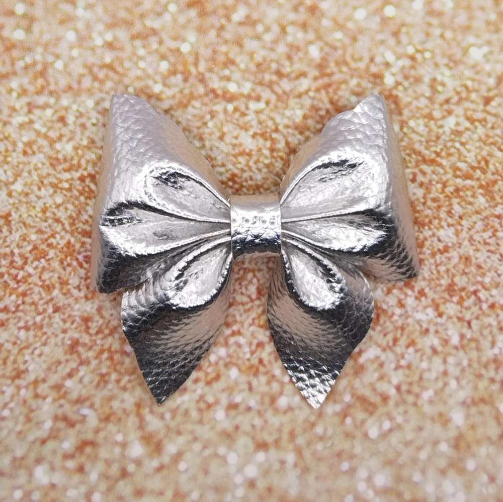 Ασημί φιόγκος κλιπ μαλλιων γυαλιστερος